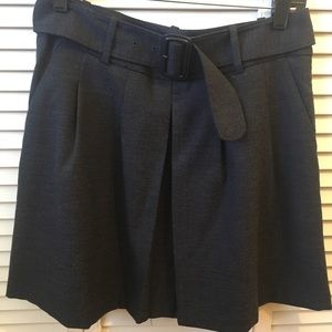 Women’s dark denim-colored belted skirt